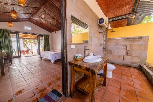 a bathroom with a sink and a toilet at Dugong Resort Phu Quoc in Phu Quoc