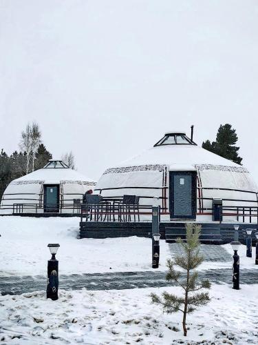 two domes with snow on them in a snow covered field at Tsomtsog Ger, Seven Nuga Resort 