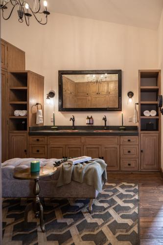 a kitchen with a sink and a table in a room at Private Jacuzzi & Pool, Elegant La Escondida 5BR in San Miguel de Allende