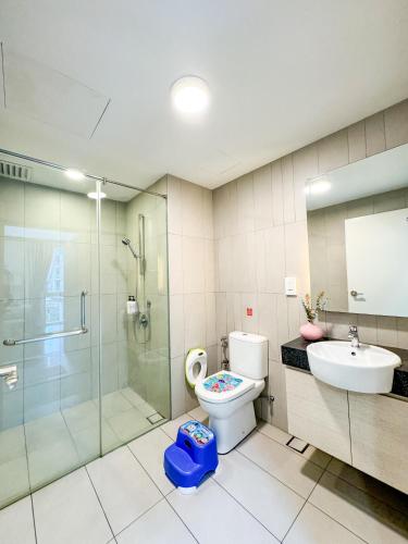 a bathroom with a shower and a toilet and a sink at KidsVille Slide LoftPlay Safari, Afiniti I 5mins Walk to Legoland JB, Johor Bahru, Malaysia in Nusajaya