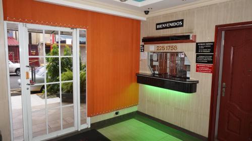 a front door of a fast food restaurant with a rainbow at Residencial Alameda in Panama City