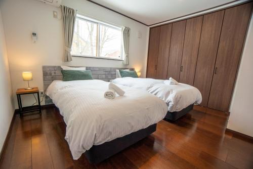 Letto o letti in una camera di Le Bocage - Hakuba Echoland Chalets