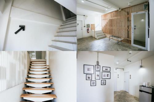 a staircase in a house with white walls at The Memory Shop Coffee Studio X Poshtal in Lampang