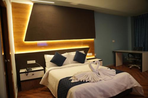 Ένα ή περισσότερα κρεβάτια σε δωμάτιο στο Hotel New Blue Earth