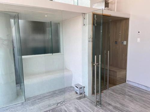 a bathroom with a shower and a glass door at Best View in Marina puerto Vallarta in Puerto Vallarta