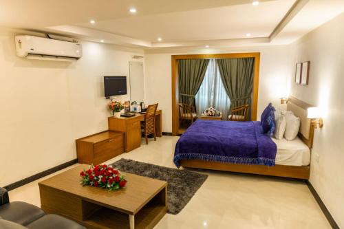 Ένα ή περισσότερα κρεβάτια σε δωμάτιο στο Hill Palace Hotel & Spa