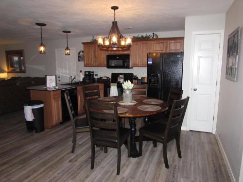 a kitchen and dining room with a table and chairs at Lakefront Condo A-1 with Large Balcony in Hollister