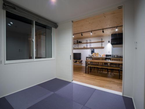 a living room and dining room with a dining table at Rakuten STAY HOUSE x WILL STYLE Itoshima in Itoshima