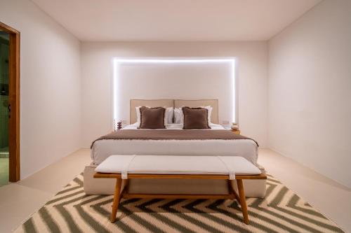 a bedroom with a large bed and a rug at Casa Dala Canggu in Canggu