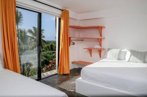Tempat tidur dalam kamar di Espectacular Villa con vista al mar, Las Terrenas