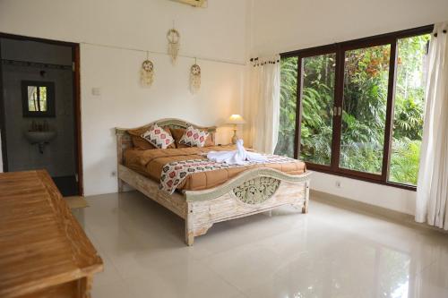 Giường trong phòng chung tại The sowan ubud