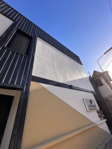 a house with a black roof at Urban Boutique Hotel in Boracay