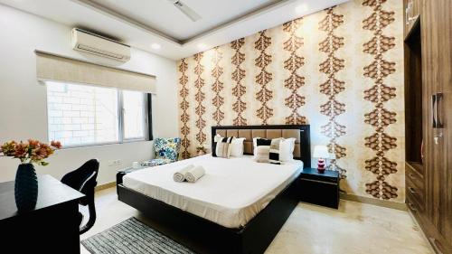 Postel nebo postele na pokoji v ubytování Olive Serviced Apartments - Central Delhi