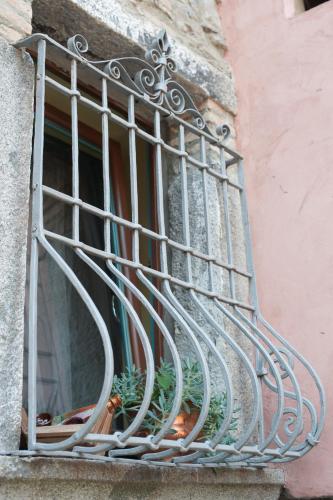 a balcony with a metal railing on a window at I Due Loft in Ceto