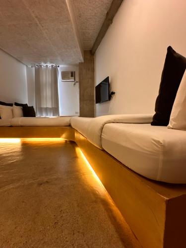 a hotel room with a bed with lights on the floor at Urban Boutique Hotel in Boracay