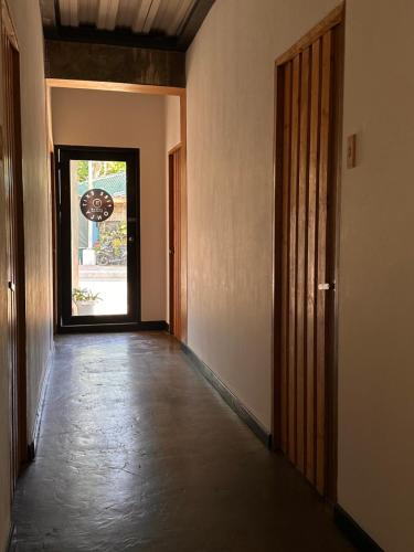 an empty hallway with a door and a window at Urban Boutique Hotel in Boracay