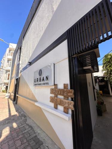a store with a sign on the side of a building at Urban Boutique Hotel in Boracay