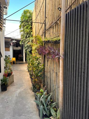 a fence with plants on the side of a building at Urban Boutique Hotel in Boracay