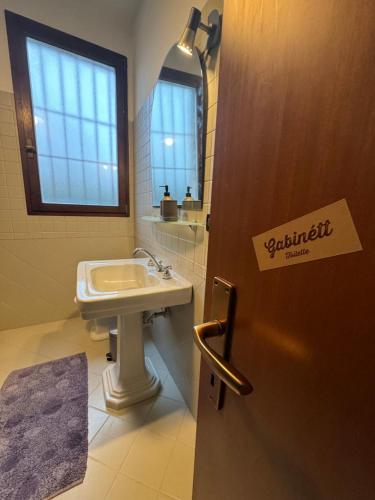 a bathroom with a sink and a mirror at Affittacamere Ca' de Mazapedar in San Lorenzo