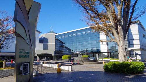 a large glass building with a tree in front of it at Toyoko Inn Tokyo Keio-sen Higashi-fuchu-eki Kita-guchi in Fuchu