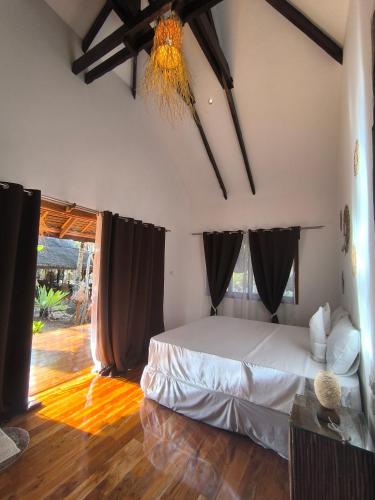 a bedroom with a bed in a room at U Story Resort in Siquijor