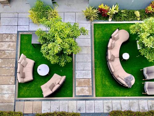 an overhead view of a garden with a bench and table at Ahola Thoddoo, Maldives in Thoddoo