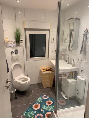 a bathroom with a toilet and a sink at Central Private Room Near Messe (Fair) in Frankfurt