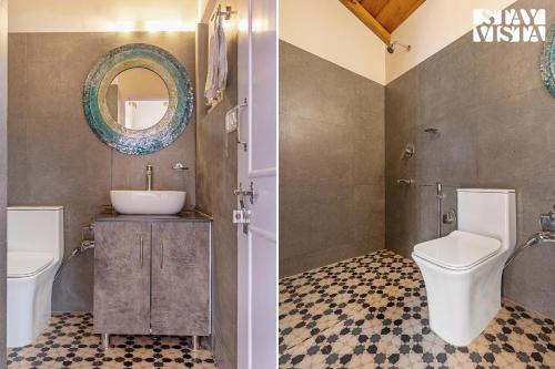 a bathroom with a toilet and a sink and a mirror at StayVista at Bird's Crest Valley Villa in Rāmgarh