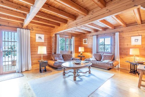 a living room with a couch and a table at Allgäu Nest in Bad Hindelang