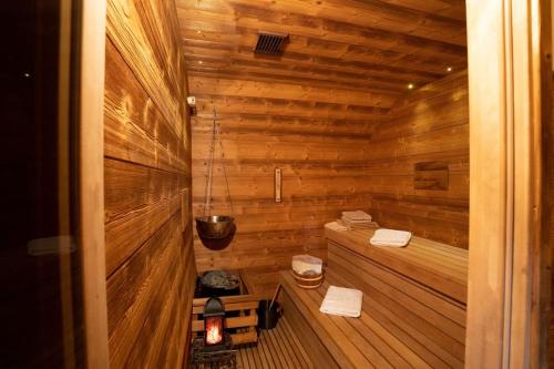 a small wooden sauna with two towels in it at Residence Moritz in Mozirje
