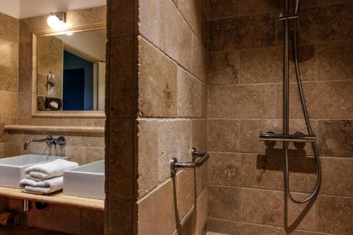 a bathroom with a shower and a sink at Charembeau in Forcalquier