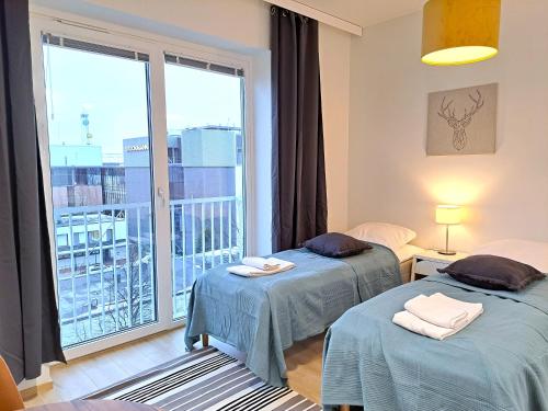 Foto Kotimaailma Apartments - moderni keskustayksiö - Aleksanterinkatu 3