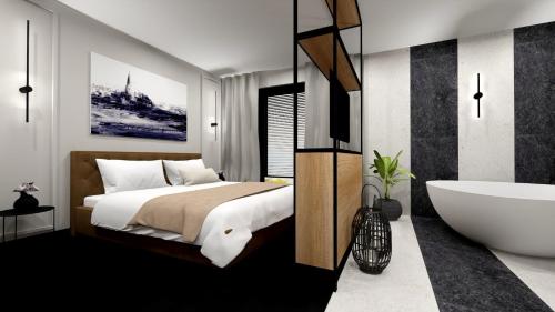 sypialnia z dużym łóżkiem i wanną w obiekcie Amber Blue Wellness & SPA w Karwii