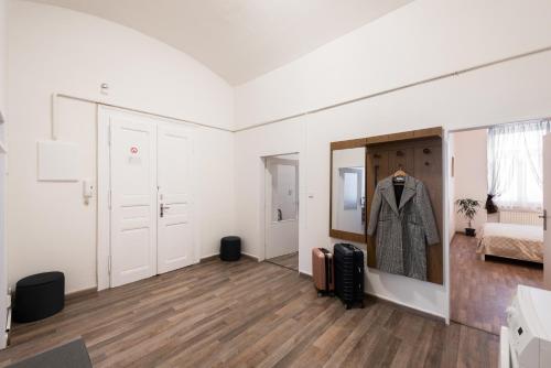 a room with a coat hanging on a wall at Prague - Karlin Apartments in Prague