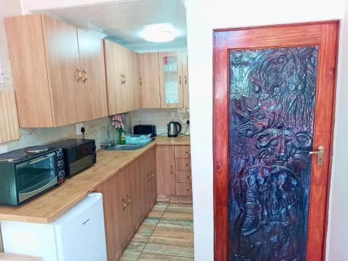 Kuchyň nebo kuchyňský kout v ubytování Queensburgh B&B or Self Catering