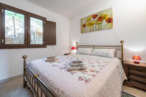 a bedroom with a large bed in a room at Lovely house in Santa Luria