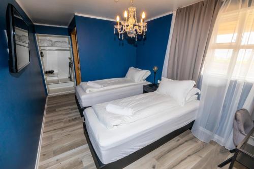 Postel nebo postele na pokoji v ubytování Hotel North