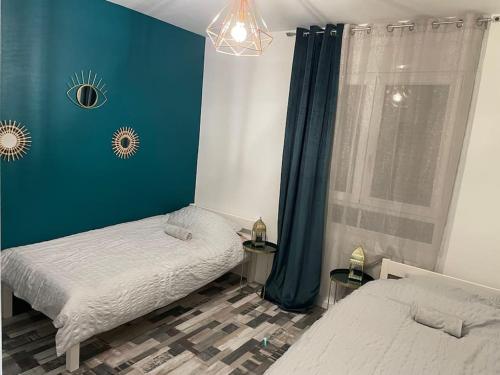 Postel nebo postele na pokoji v ubytování Super appartement By live cité gastronomique