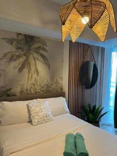 Katil atau katil-katil dalam bilik di Serenity Haven by J&M at Azure North Pampanga