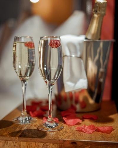 two glasses of champagne on a wooden table at Owston Hall Hotel in Doncaster