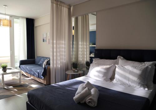 Кровать или кровати в номере Syntagma Sweet House