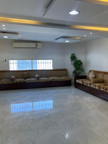 a waiting room with couches in a building at شاليه 1 in Al Ḩazm