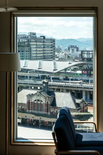 a view of a city from a window at Norden Ruder Hostel Taichung in Taichung