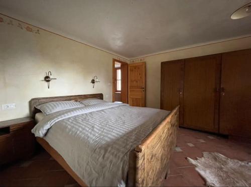 a bedroom with a large bed in a room at Traditional Slovenian house in Vransko