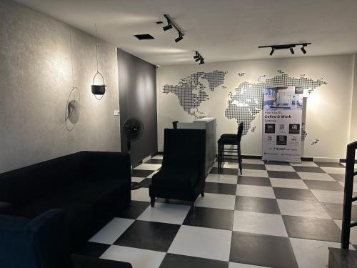 a waiting room with a map of the world on the wall at Collection O Local Square | Whitefield in Bengaluru