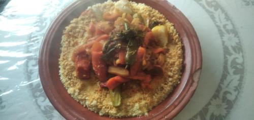 a bowl of food with carrots and other vegetables at Familles avec bébé in Fès