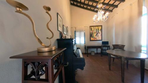 a living room with a table and a dining room at Hotel Utopía in Benalup Casas Viejas