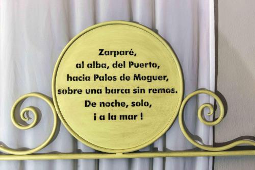 a mirror on a shelf with a sign on it at Hotel Utopía in Benalup Casas Viejas