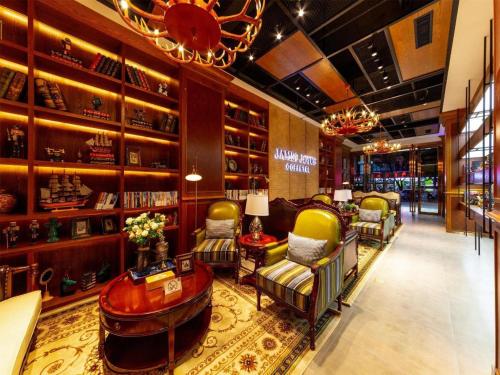 a store with chairs and a table in a room at James Joyce Coffetel Kunming Railway Station Huancheng Nan Road Metro Station in Kunming