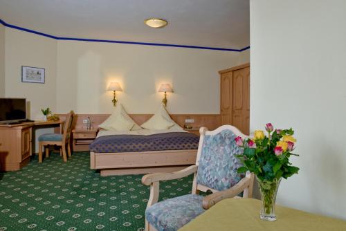 En eller flere senge i et værelse på Landhotel Bärnriegel